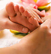 hands rubbing foot